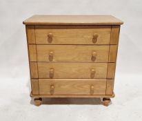 Modern lightwood chest with four long drawers, 87cm high x 84cm wide x 50cm deep