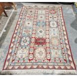Modern Moroccan cream ground rug with three rows of six of alternating square floral pattern