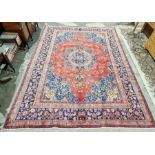 North West Persian Birjand red ground carpet with central floral medallion enclosed by floral