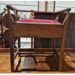 Mahogany upholstered piano stool with lift-up lid to seat