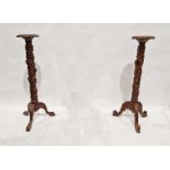 Pair of mahogany jardiniere stands, relief decorated with fruiting vines (2)