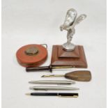 'Spirit of Ecstasy' car mascot mounted on a wooden base, two stainless steel Parker pen biros, two