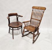Early 20th century oak and elm railback rocking chair, purchased from Liberty's, 107cm high and a