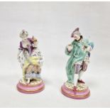 Pair of Meissen-style porcelain figures of a lady and gallant, each on pink and gilt circular