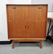 Dalescraft mid-century teak-effect bureau cupboard, the drop front opening to reveal fitted