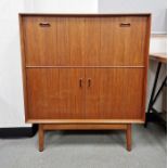 Dalescraft mid-century teak-effect bureau cupboard, the drop front opening to reveal fitted