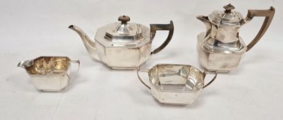 Silver four-piece tea service, each piece rectangular and panelled with engraved scroll border,