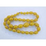 String of butterscotch yellow graduated amber beads, 70cm long approx.