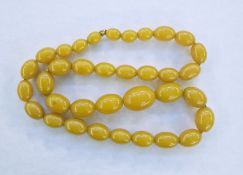 String of butterscotch yellow graduated amber beads, 70cm long approx.