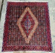 North West Persian blue ground Senneh rug with central staggered lozenge on geometric field,