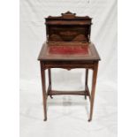 19th century rosewood child's desk with lift-up lid enclosing pigeonholes, on tapering supports