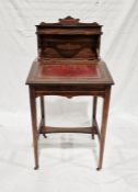 19th century rosewood child's desk with lift-up lid enclosing pigeonholes, on tapering supports