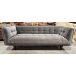 Contemporary three seat velvet upholstered sofa, grey in colour, raised upon turned feet, 74cm