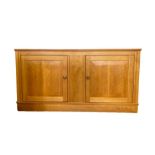 Modern lightwood, possibly maple, sideboard having moulded edge, two cupboards enclosed by framed