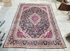 North East Persian blue ground Meshed carpet with graduated central floral medallion on floral field
