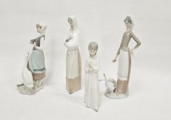 Lladro figurine of a woman with a goose, a Lladro figurine of a woman with two geese, model number