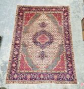 North West Persian cream ground Tabriz carpet with central floral medallion on graduating floral