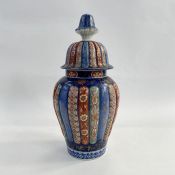 Japanese Imari ribbed porcelain vase, inverse baluster shape and the high domed cover, 40cm high