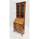 Early 20th century burr walnut veneer corner cabinet bureau, the top section having two glazed doors