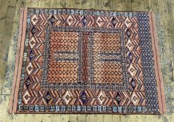 Ersari engsi wool rug, the quartered pale madder field with geometric decoration and having broad