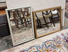 Two wall mirrors, both of rectangular form, one having a gilt frame, the other white painted,