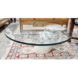 Contemporary glass-topped coffee table of oval form, raised on large single piece of cylindrical