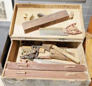 Vintage wooden toolbox including assorted vintage tools, such as planes, drills, saws, hammers etc.