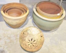 Quantity of large terracotta and stoneware plant pots