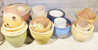 Large quantity of terracotta and stoneware plant pots