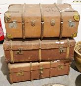 Three vintage canvas and bentwood trunks