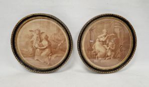 Two sepia classical prints in circular gilt and ebonised wooden frames (2)