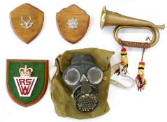 Brass bugle with Royal Artillery cap badge, three plaques, two with Scottish regimental cap badges