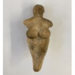 Stone Age Venus idol with small cavity in the legs, 12cm x 6cm wide approx.