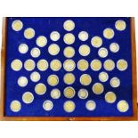 Presentation case of brass and silver 3d in a purpose built case, case opens to access coins,