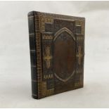 Victorian photograph album music box, the pages printed with decorative chromolithograph floral