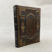 Victorian photograph album music box, the pages printed with decorative chromolithograph floral