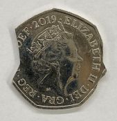 Error 50p coin with notches on either edge, with letter of authenticity from the Royal Mint Museum