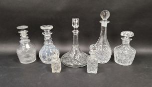 Stuart cut glass decanter and six assorted clear glass decanters and bottles (7)