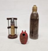 Decommissioned armour piercing round within a little display unit, a trench art  shell and a