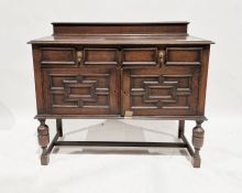 20th century stained oak sideboard with pair of drawers above pair of panelled cupboards, on