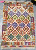 Chobi kilim cream ground wool rug with lozenge trelliswork pattern and geometric border , 130cm x