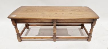 Mid 20th century Ercol rectangular coffee table on turned supports united by stretchers, 41cm high x