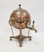Copper and brass samovar, ovoid, on four column supports, the base with round ball feet, 43cm high