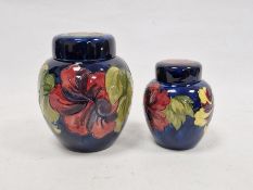 Moorcroft 'Hibiscus' pattern ginger jar, blue ground, signed to base, 20cm high approx. and