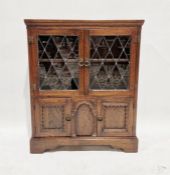 Oak display cabinet having leaded glazed doors, cupboard below, 102.5cm high x 84cm wide x 26cm deep
