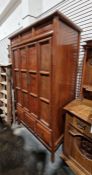 20th century walnut Oriental-style cabinet with folding panelled doors, three drawers to base