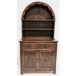Oak Old Charm-style dresser, the arched raised back with two shelves, two drawers, cupboards below
