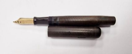 Swan fountain pen with a 14ct gold nib, marked 'Swan', within a mottled bakelite case