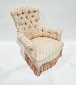 Pink buttonback bow upholstered armchair on turned supports and castors