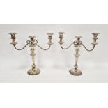 Pair of silver-plated three-branch candelabra, each 35cm high approx. (2)